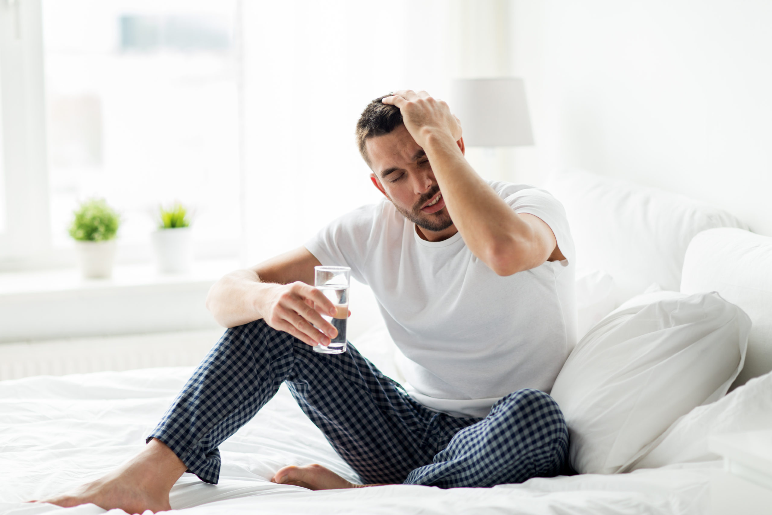 man sitting with a hangover