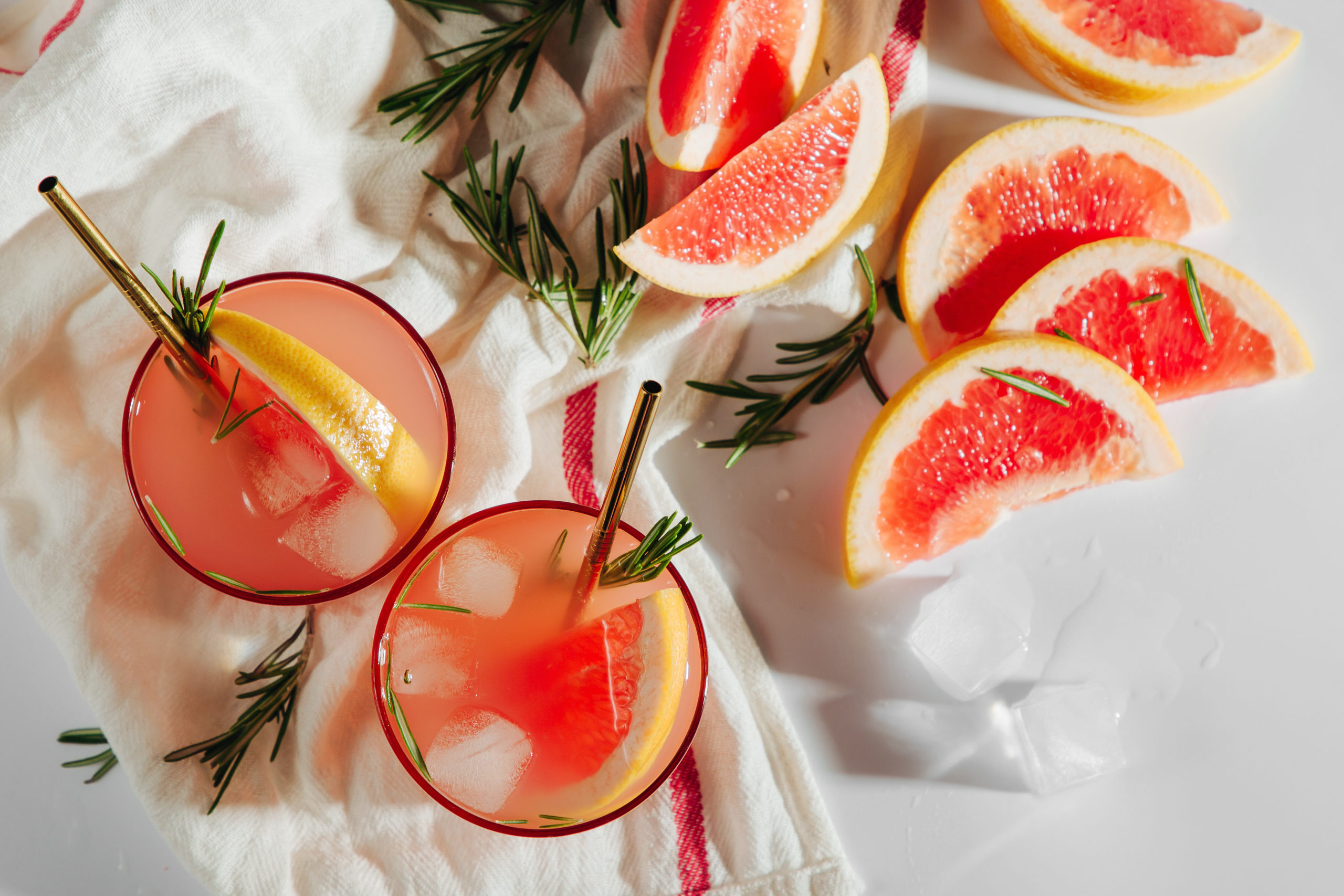 Homemade Cocktail making. Grapefruit and Rosemary cocktail.  Refreshing and non-alcoholic drink perfect for spring or summer.