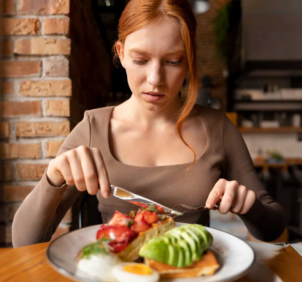 a lady eating a healthy meal after getting her food sensitivity testing results