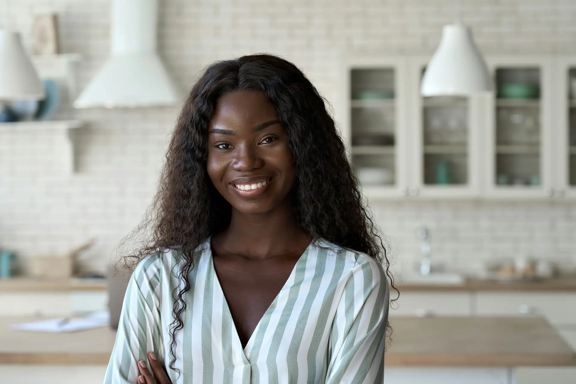 headshot-portrait-of-young-black-woman-looking-at-camera-indoors-.jpg