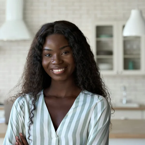 headshot-portrait-of-young-black-woman-looking-at-camera-indoors-.jpg